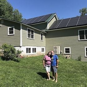 Happy customers after a completed Vermont solar project