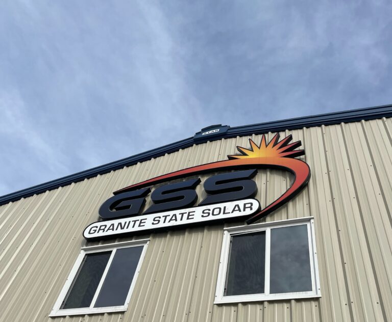 Industrial building with the GSS Granite State Solar logo.
