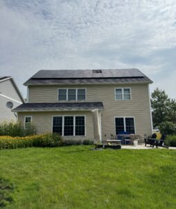 The rear of a Vermont home with solar panels on the roof to illustrate what size solar system is needed for a typical Vermont house.